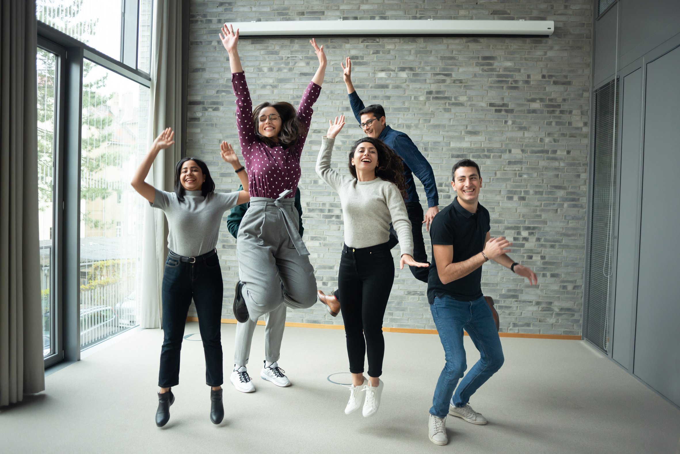 Happy business people celebrating success at office